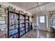 Cozy library nook with floor-to-ceiling bookshelves and a comfortable reading chair at 13575 Martha Ave, Port Charlotte, FL 33981