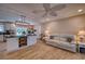 Bright and spacious living room and kitchen with an island, modern lighting, and luxury vinyl floors at 13575 Martha Ave, Port Charlotte, FL 33981