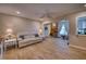 Comfortable living space with a view into living room featuring stone wall and neutral interior at 13575 Martha Ave, Port Charlotte, FL 33981