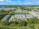 Aerial view showcases Nokomis Beach community with lush greenery, serene ponds, and convenient access to nearby beaches at 17136 Blowfish Dr, Nokomis, FL 34275