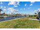Waterfront backyard with grass and dock at 23 Ocean Dr, Punta Gorda, FL 33950