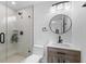 Bathroom with a glass enclosed shower, black fixtures, and modern vanity at 23 Ocean Dr, Punta Gorda, FL 33950