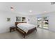 Light-filled bedroom with water views, modern furniture, and neutral paint at 23 Ocean Dr, Punta Gorda, FL 33950