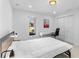 Well-lit bedroom with white walls, hardwood floors, closet and desk at 23 Ocean Dr, Punta Gorda, FL 33950
