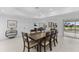 Spacious dining room with sleek wood table, decor and sliding doors at 23 Ocean Dr, Punta Gorda, FL 33950