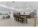 Open dining area with a large table, modern lighting, and scenic views at 23 Ocean Dr, Punta Gorda, FL 33950