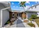 A single-story home featuring manicured landscaping and a modern facade with elegant accents at 23 Ocean Dr, Punta Gorda, FL 33950