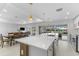 Kitchen and dining area with island, modern appliances, and backyard view at 23 Ocean Dr, Punta Gorda, FL 33950