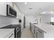 A clean, modern kitchen with white cabinets, updated appliances, and ample counter space at 23 Ocean Dr, Punta Gorda, FL 33950