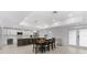 Bright kitchen features stainless steel appliances, white cabinetry and a dining table at 23 Ocean Dr, Punta Gorda, FL 33950