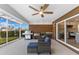Covered patio featuring outdoor kitchen, grill, sink and waterfront views at 23 Ocean Dr, Punta Gorda, FL 33950