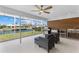 Covered patio featuring outdoor kitchen, grill, sink and waterfront views at 23 Ocean Dr, Punta Gorda, FL 33950