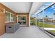 Covered patio featuring outdoor kitchen, grill, sink and waterfront views at 23 Ocean Dr, Punta Gorda, FL 33950