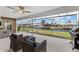 Covered patio featuring outdoor kitchen, grill, sink and waterfront views at 23 Ocean Dr, Punta Gorda, FL 33950