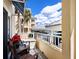 Relax on this condo's balcony with beautiful views of the property and the sky at 2424 Placida Rd # C104, Englewood, FL 34224