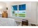 Bedroom window with white shutters showcases the beautiful waterfront view at 2424 Placida Rd # C104, Englewood, FL 34224