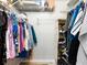 Walk-in closet with metal shelving and hanging rods for optimal storage at 2424 Placida Rd # C104, Englewood, FL 34224