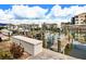 Boat docks with storage boxes and posts with ropes sit on the water near condos at 2424 Placida Rd # C104, Englewood, FL 34224