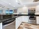 Modern kitchen featuring stainless steel appliances and black granite counters at 2424 Placida Rd # C104, Englewood, FL 34224