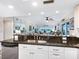 Open kitchen featuring stainless steel dishwasher and granite countertop at 2424 Placida Rd # C104, Englewood, FL 34224