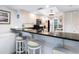 Well-lit kitchen area with white cabinetry and sleek black countertops at 2424 Placida Rd # C104, Englewood, FL 34224
