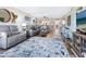 Spacious living room featuring stylish furniture and a large area rug at 2424 Placida Rd # C104, Englewood, FL 34224