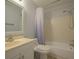 Bathroom features a shower-tub combo and vanity with sink at 2625 Pine Lake Ter # B, Sarasota, FL 34237