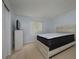 A carpeted bedroom showcasing a neutral color palette at 2625 Pine Lake Ter # B, Sarasota, FL 34237