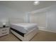 A bedroom with carpet flooring, window view, and a neutral color scheme at 2625 Pine Lake Ter # B, Sarasota, FL 34237