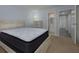 Cozy bedroom featuring carpet floors and a view to the bathroom at 2625 Pine Lake Ter # B, Sarasota, FL 34237