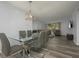 Open dining area with views of the living room at 2625 Pine Lake Ter # B, Sarasota, FL 34237