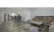 Spacious living area with modern design, featuring comfortable seating and contemporary flooring at 2625 Pine Lake Ter # B, Sarasota, FL 34237