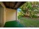 Exterior patio area with natural green setting at 2625 Pine Lake Ter # B, Sarasota, FL 34237