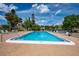 Outdoor pool with seating and nearby parking at 2625 Pine Lake Ter # B, Sarasota, FL 34237