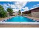 Community swimming pool with crystal blue water and a spacious deck for lounging at 2625 Pine Lake Ter # B, Sarasota, FL 34237