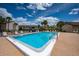 Enjoy the community's swimming pool featuring lounge chairs and a pristine pool setting at 2625 Pine Lake Ter # B, Sarasota, FL 34237