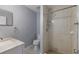Bathroom featuring a single vanity and a tiled walk-in shower with a modern shower head at 2720 60Th Avenue W Dr # D, Bradenton, FL 34207