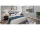 Comfortable bedroom featuring contemporary decor, stylish lighting, and a large window at 2720 60Th Avenue W Dr # D, Bradenton, FL 34207