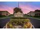 Entrance to Huntington Woods Condominiums with a large sign surrounded by lush landscaping at 2720 60Th Avenue W Dr # D, Bradenton, FL 34207