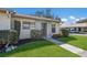 Inviting single-story home with a well-manicured lawn and a paved walkway leading to the front door at 2720 60Th Avenue W Dr # D, Bradenton, FL 34207