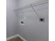 Laundry room with washer hookups and overhead shelving for organization and storage at 2720 60Th Avenue W Dr # D, Bradenton, FL 34207