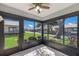 Sunroom featuring tiled floors, a ceiling fan, and sliding glass windows offering ample natural light at 2720 60Th Avenue W Dr # D, Bradenton, FL 34207