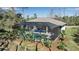 Aerial view of the home's private screened pool and lushly landscaped backyard at 2877 Sultan Ct, North Port, FL 34286