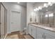 Elegant bathroom with double vanity, granite countertops, and a glass-enclosed shower at 2877 Sultan Ct, North Port, FL 34286