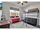 Cozy bedroom featuring a loft bed with a desk, offering a functional and efficient space at 2877 Sultan Ct, North Port, FL 34286