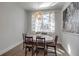 Bright dining room with modern lighting and a window view at 2877 Sultan Ct, North Port, FL 34286