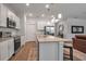 Modern kitchen features a central island and stainless steel appliances at 2877 Sultan Ct, North Port, FL 34286