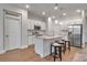 Bright kitchen featuring an island with seating and stainless steel appliances at 2877 Sultan Ct, North Port, FL 34286