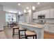 Bright kitchen featuring an island with seating and stainless steel appliances at 2877 Sultan Ct, North Port, FL 34286