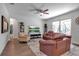 Spacious living room with natural light and a sliding glass door that leads to the outdoors at 2877 Sultan Ct, North Port, FL 34286